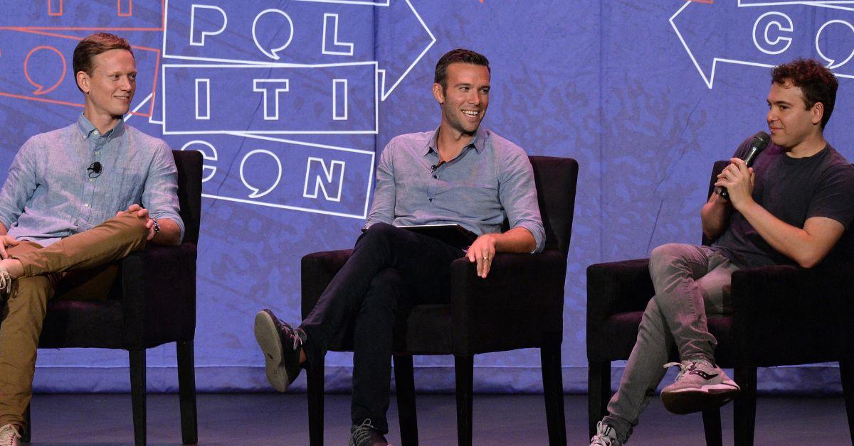 Photo of the 'Pod Save America' hosts.