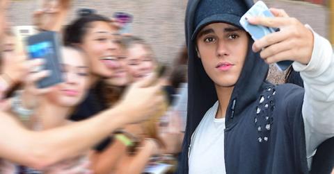 Justin Bieber charging fans for photos