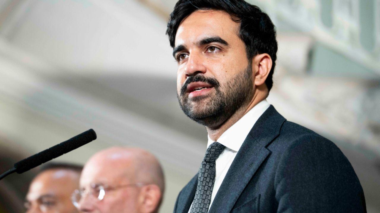 image of New York City Mayor Zohram Mamdani speaking at a press conference at City Hall.