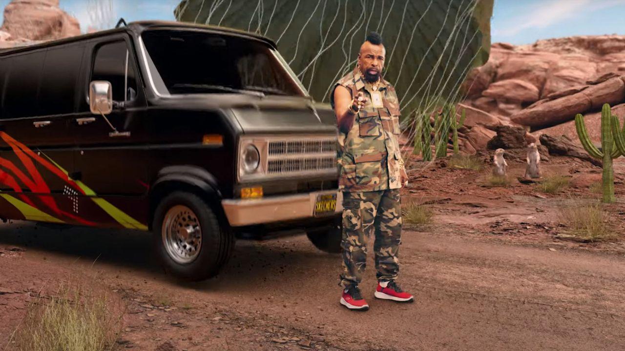 Image of Mr. T standing before a black van.