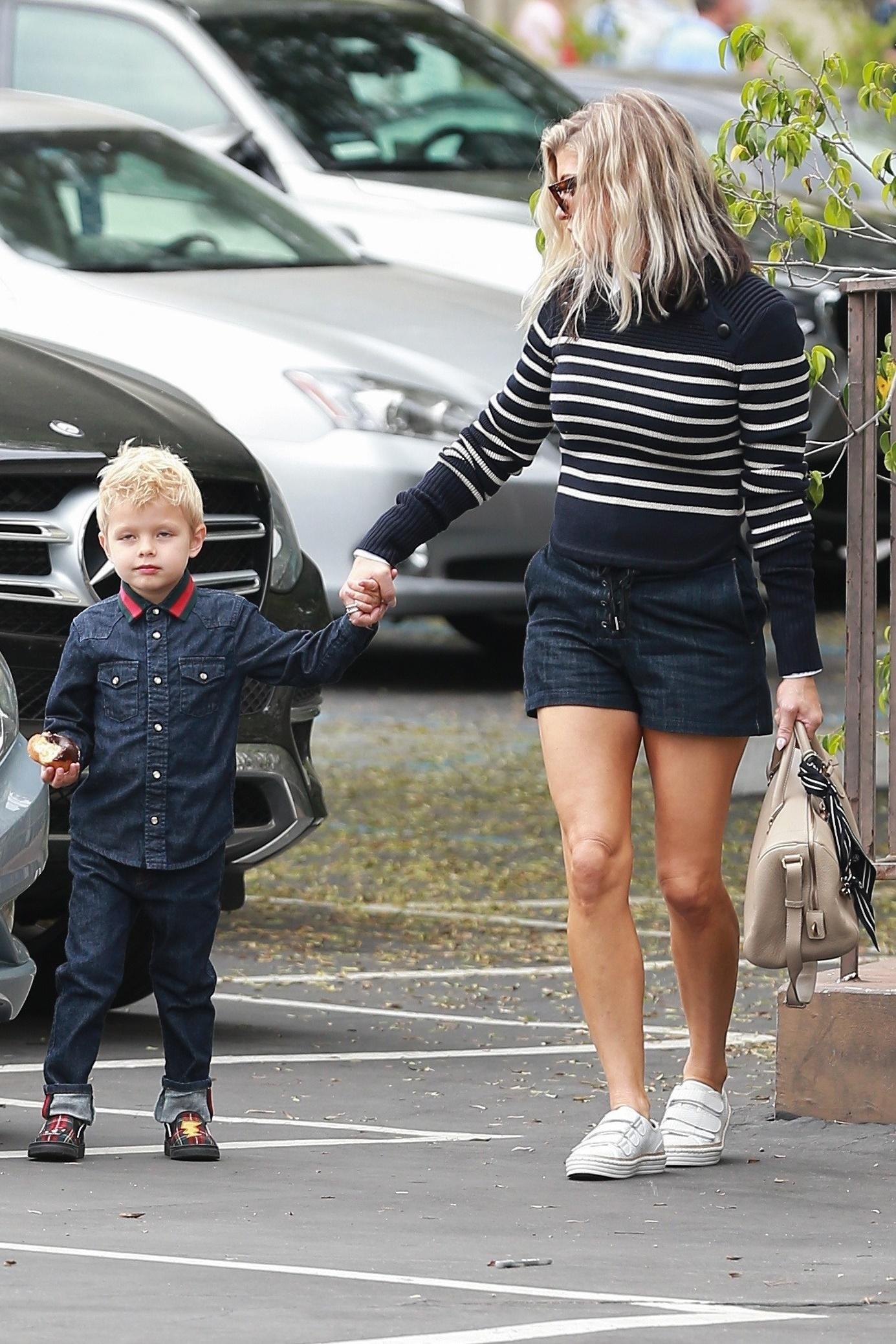 Fergie and Axl coordinate their looks for church