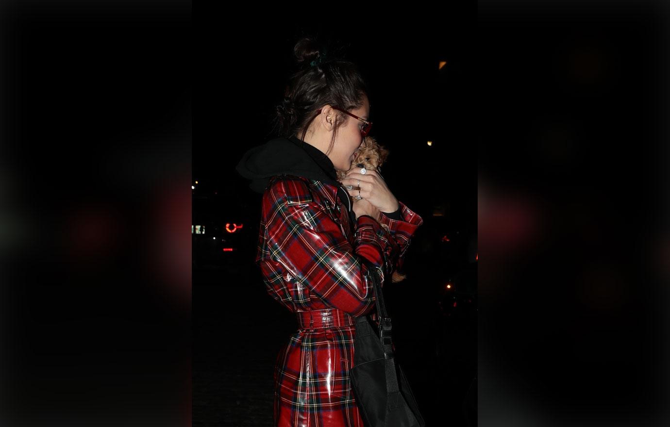 Bella Hadid cuddles a tiny puppy dog in NYC