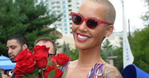 amber rose with sunglasses and flowers