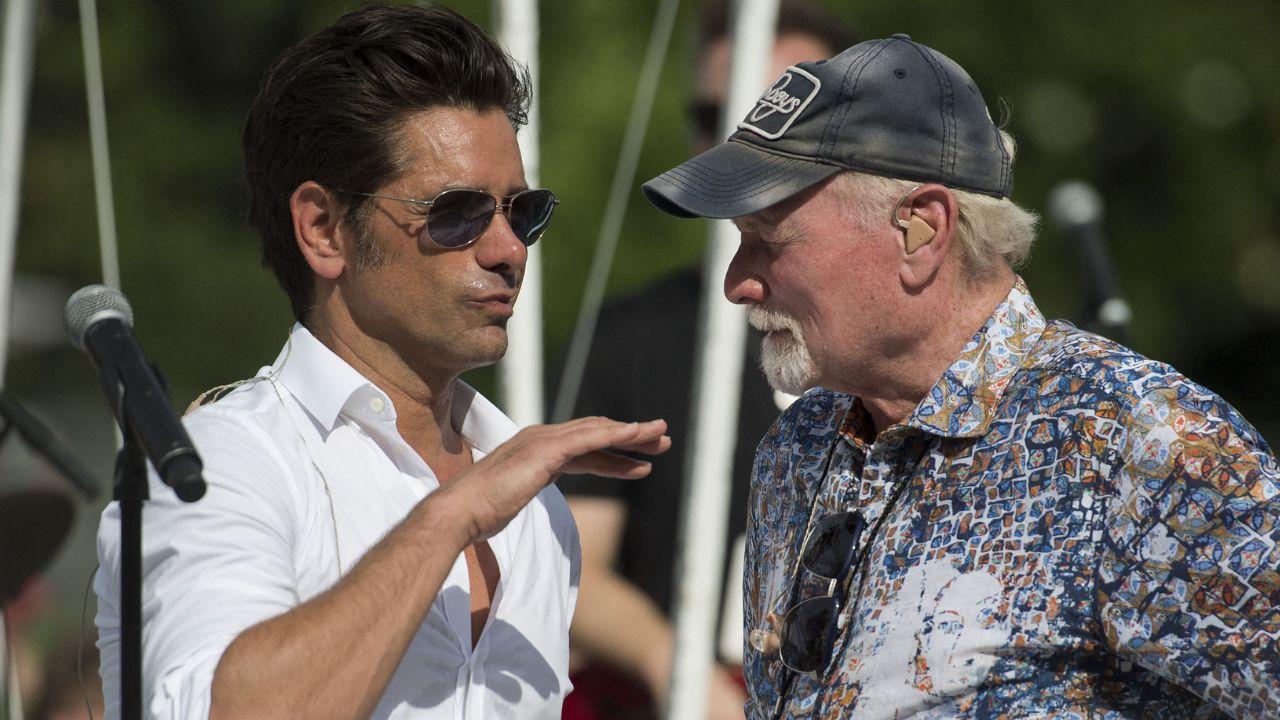 image of John Stamos called Mike Love a 'fighter.'