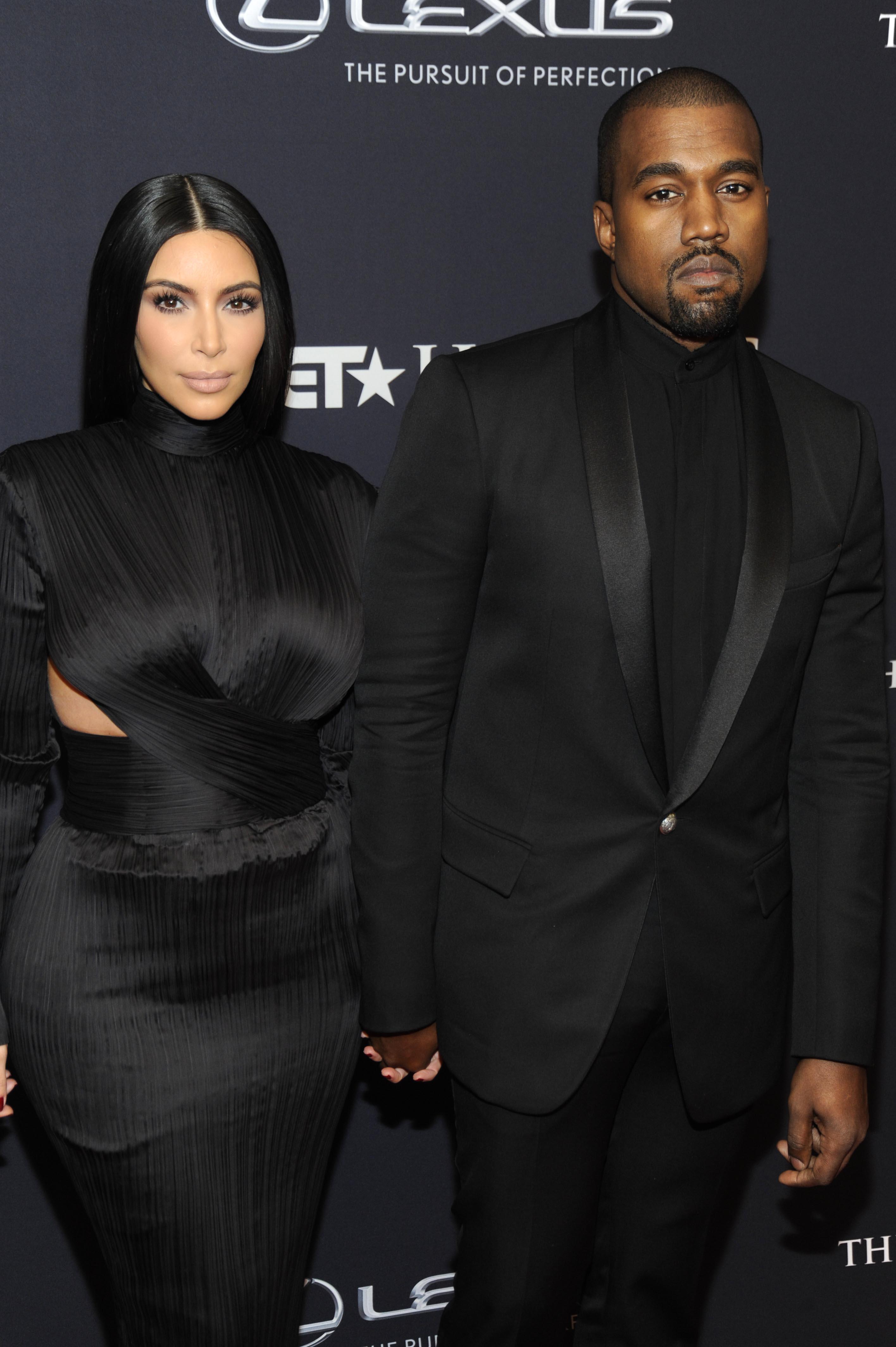 Kim Kardashian and Kanye West arrive on the red carpet at the BET Honors in Washington, DC