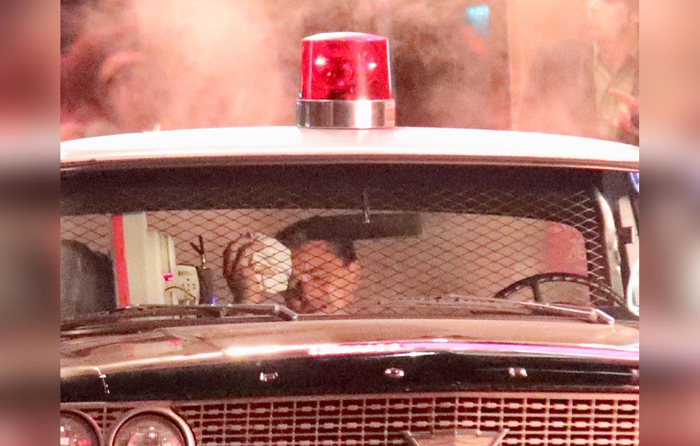 EXCLUSIVE: Leonardo Di Caprio crashes car and is put into police car film scene for Once Upon a Time in Hollywood