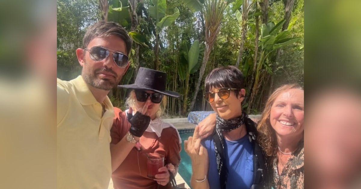 image of Britney Spears shared a playful Instagram photo holding a drink, while puckering her lips.