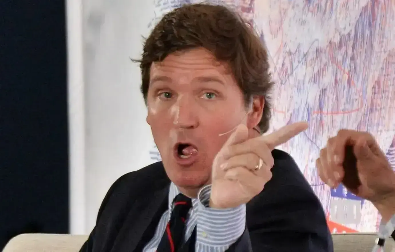 tucker carlson scars physically mauled demon bed