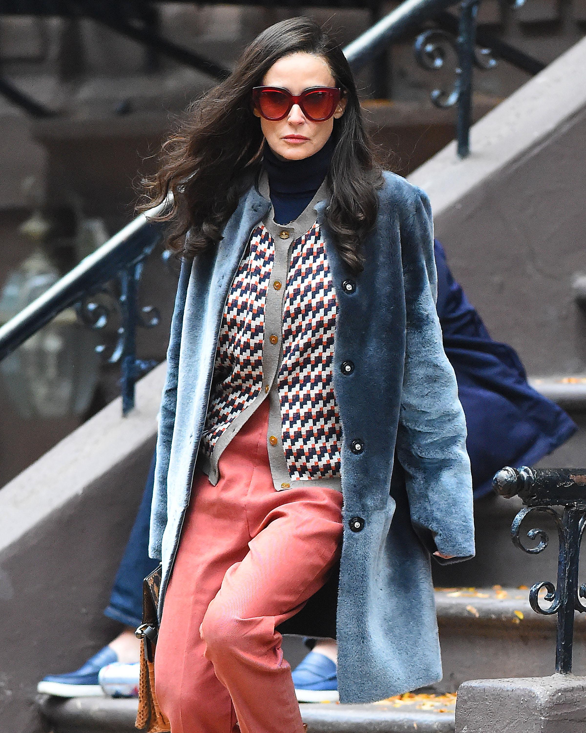 Demi Moore seen wearing a blue fur coat,peach slacks and carrying a snakeskin handbag on the set of &#8220;Blind&#8221; in Brooklyn, New York