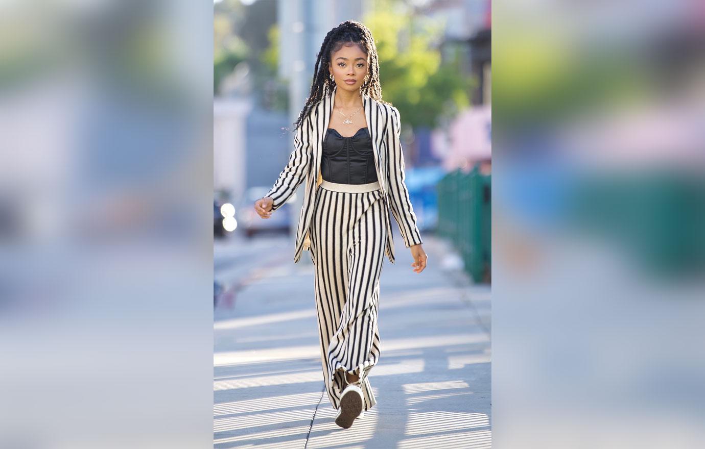 skai jackson steps out in striped pant suit