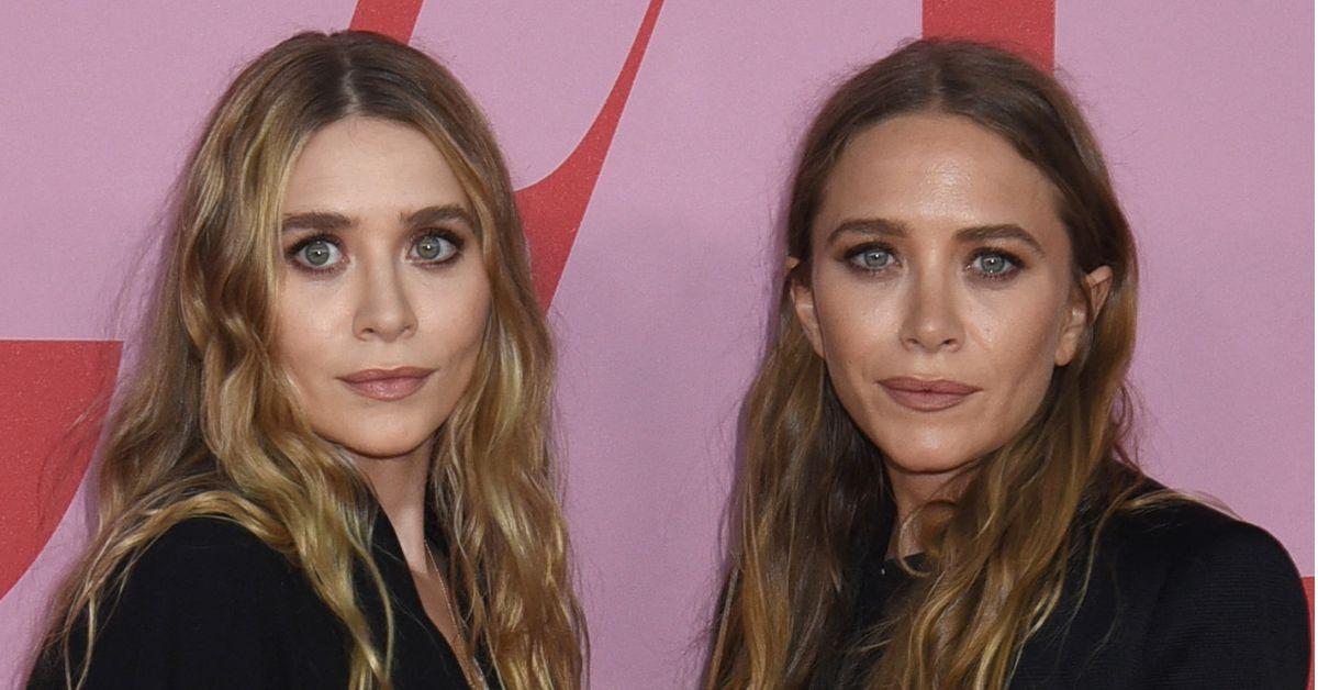 image of The twins coordinated in elegant black gowns and posed alongside Ashley's husband, Louis Eisner, and sister Elizabeth Olsen.