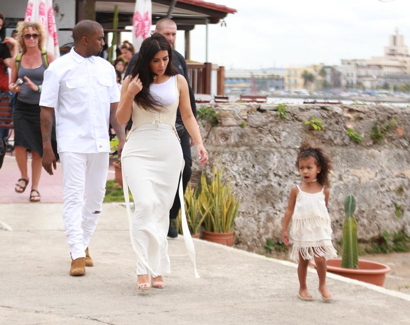 Kim Kardashian has a romantic walk with Kanye and North, as Kourtney spends quality time with her children in Cuba