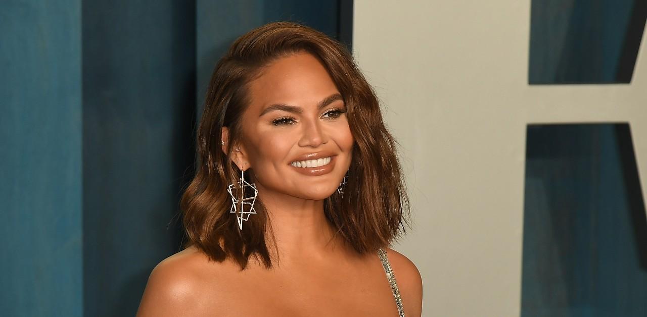 Chrissy Teigen Shows Off Bare Baby Bump In Robe: Photos