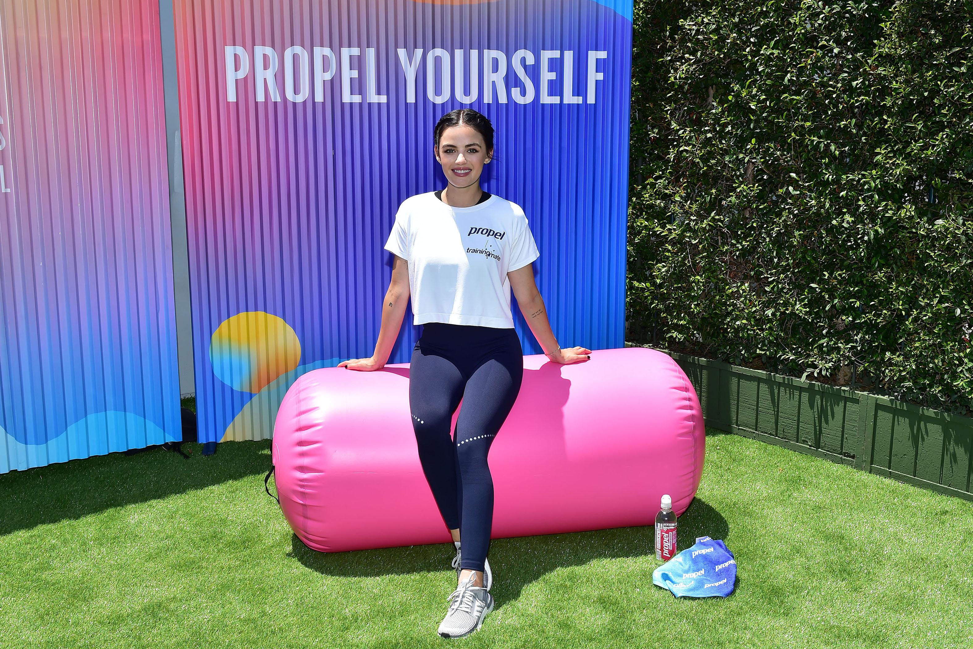 Lucy Hale co-leads a class at the Propel Co:Labs Fitness Festival with Luke Milton of Training Mate in Santa Monica.