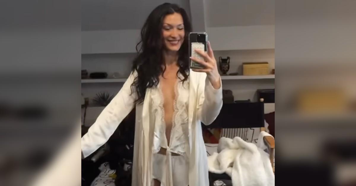 bella hadid goes braless poses white lace set watch