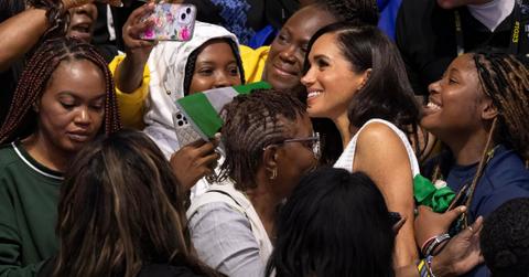 meghan markles cross pendant sent message unity royals nigeria trip