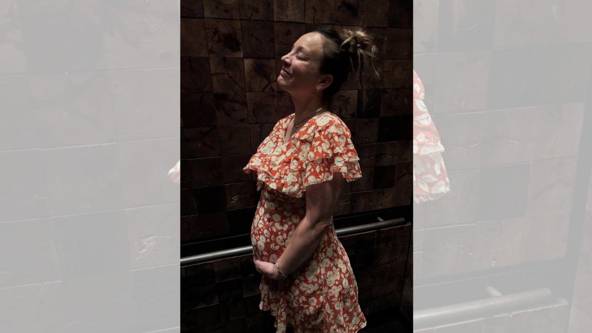 Image of Kaley Cuoco posed in a floral dress while cradling her baby bump in one of the snapshots.