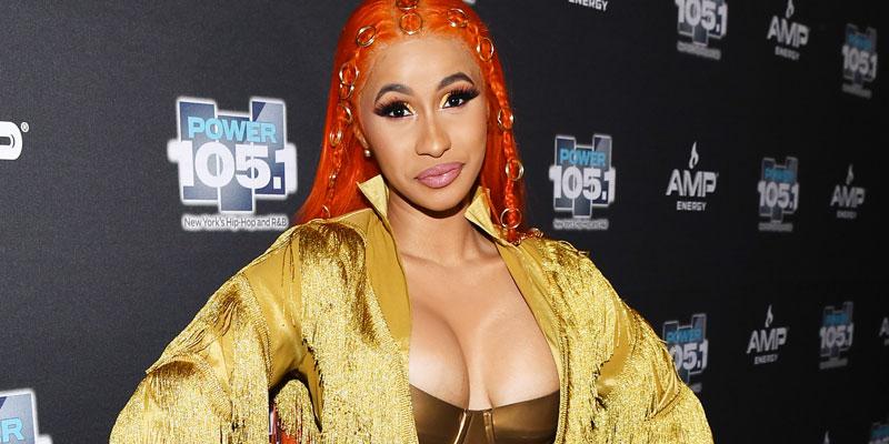 Cardi B's boobs nearly spill out of her strapless bra as she