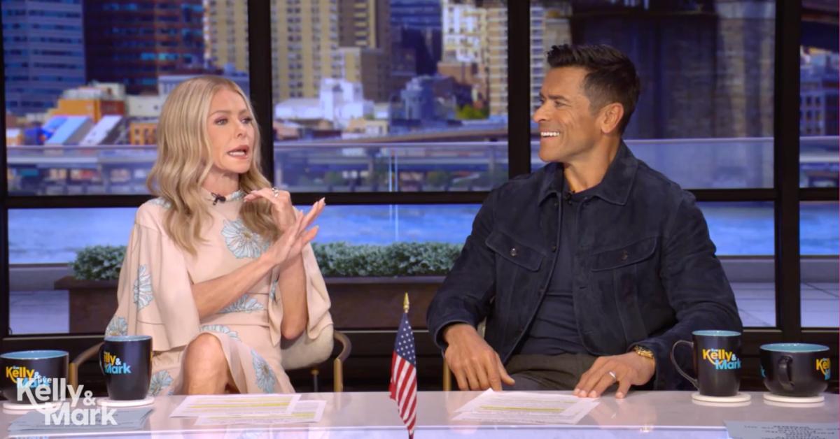 Image of Kelly Ripa doesn't want to be 'riled up' or 'cuddled' by Mark Consuelos in the morning.