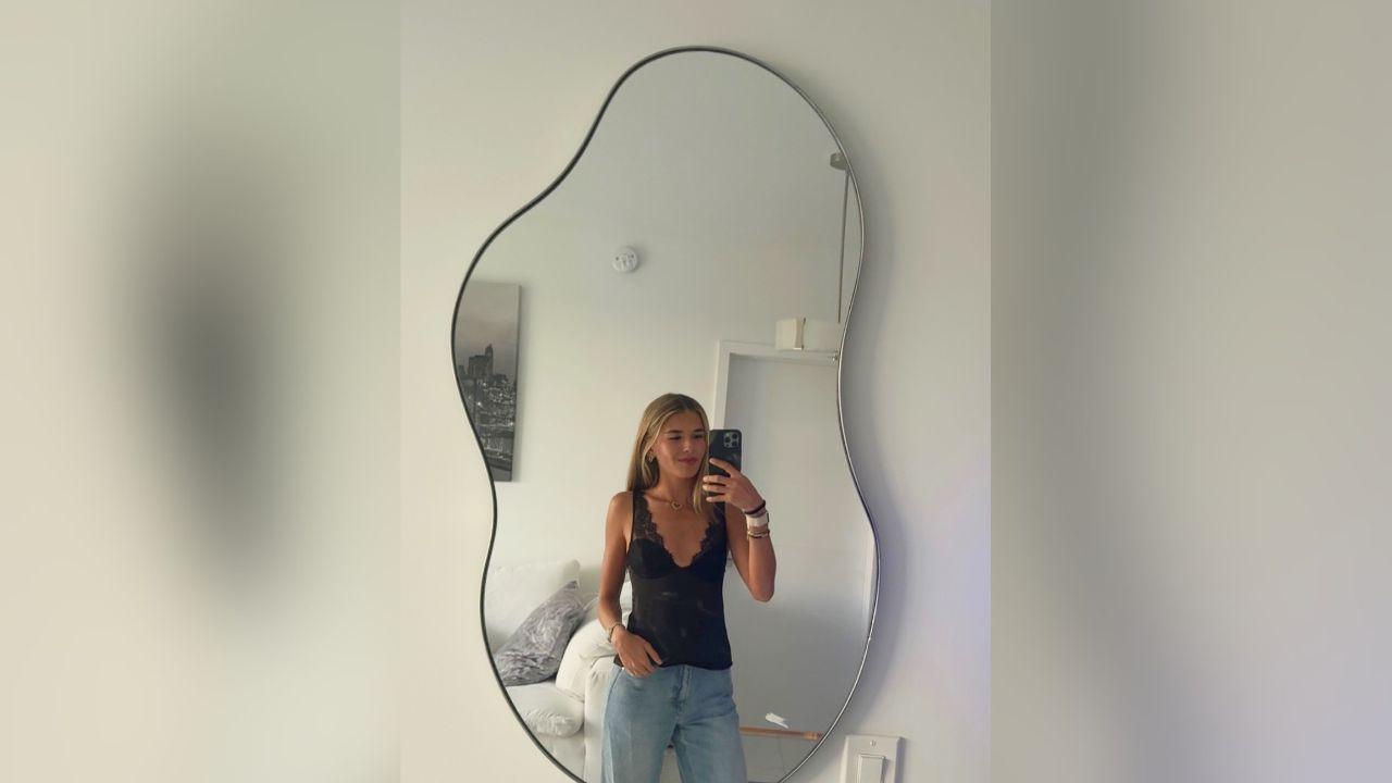 image of Kai Trump showed off a black blazer, lace-trimmed top and matching mini skirt in one of her latest mirror selfies.