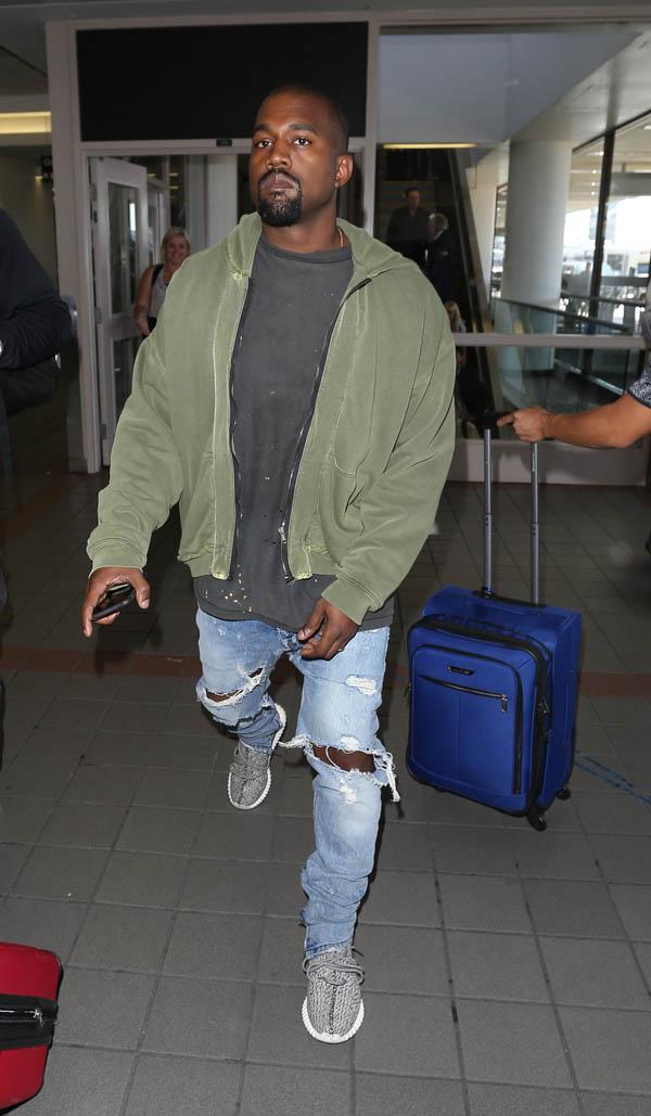 Kanye West arrives in Los Angeles as it&#8217;s reported he was upset at the sound quality at the Pan Am Games in Toronto, Canada.