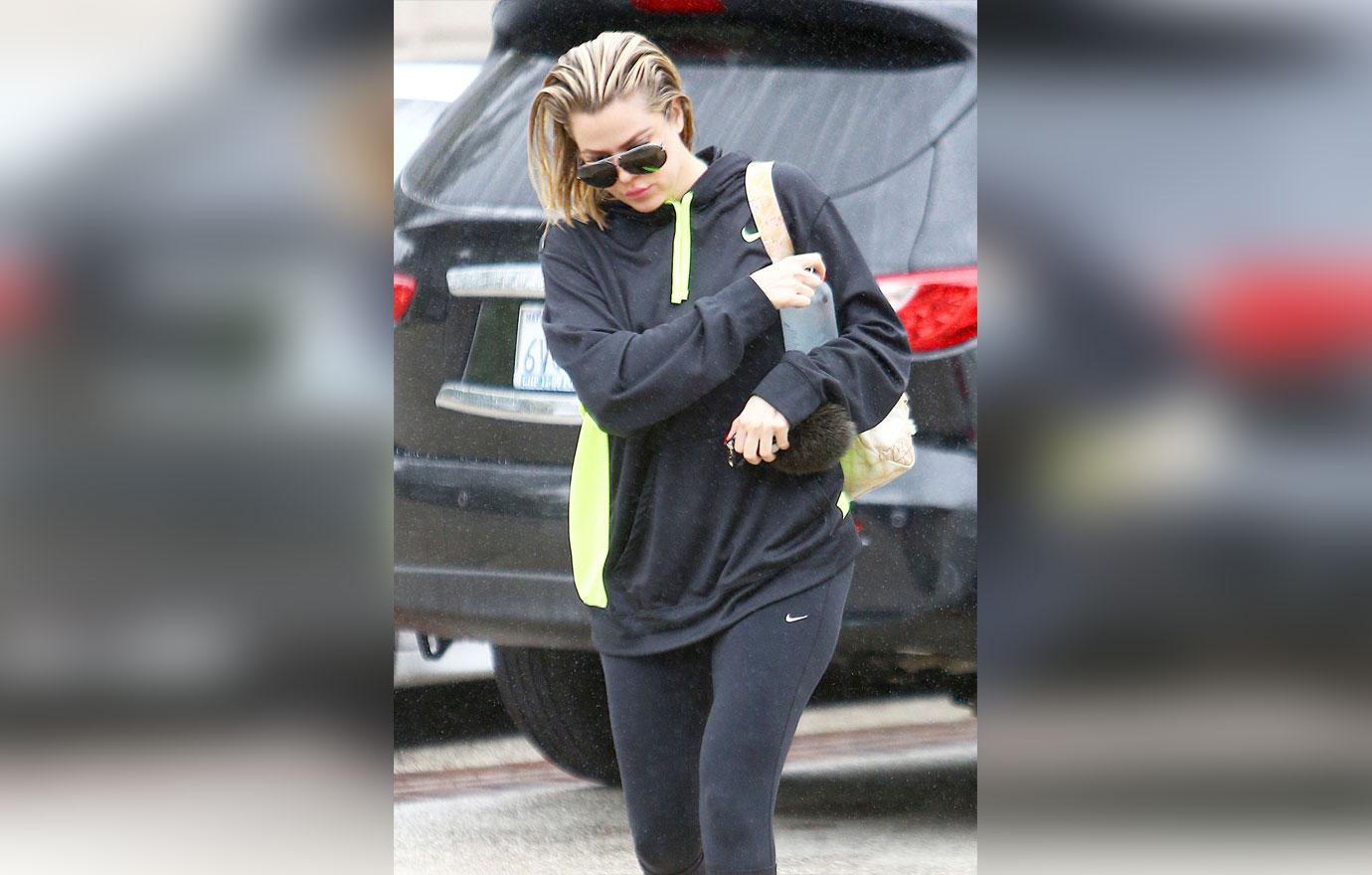 *EXCLUSIVE* Khloe Kardashian isn&#8217;t bothered by the rain as she head to Equinox