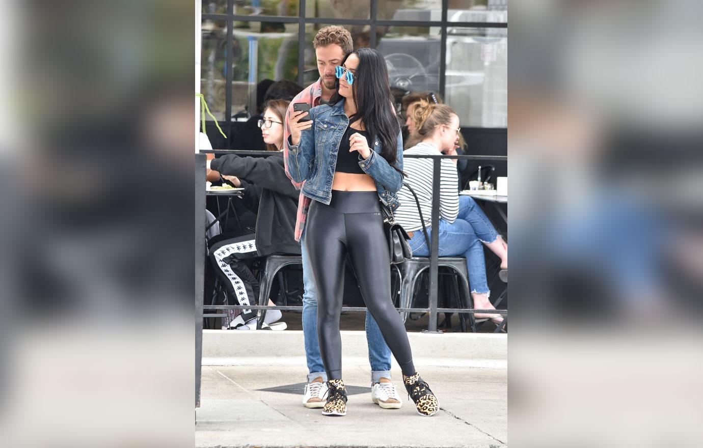 Nikki Bella wears a white crop top and grey leggings for a lunch