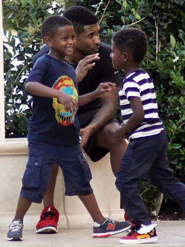 Usher seen playing with sons