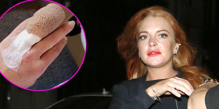 Lindsay Lohan and a friend pose for photos leaving the Libertines nightclub at 3am