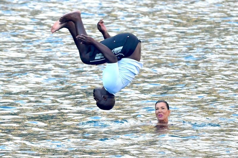 Kris Jenner and Corey Gamble hit the water for a swim with Kourtney and Mason