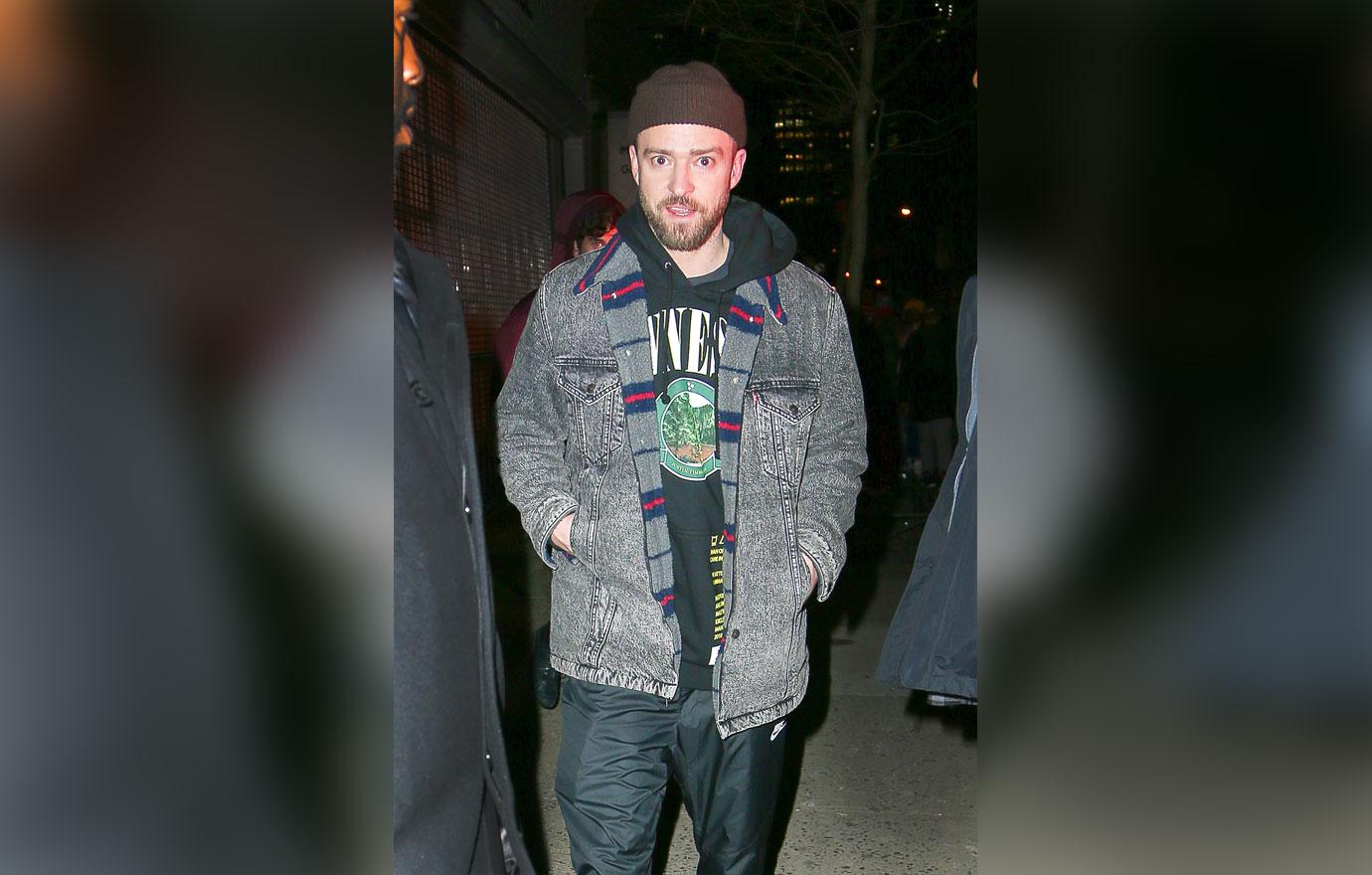 Justin Timberlake throws a peace sign while leaving the Nike Pop Up store in New York City