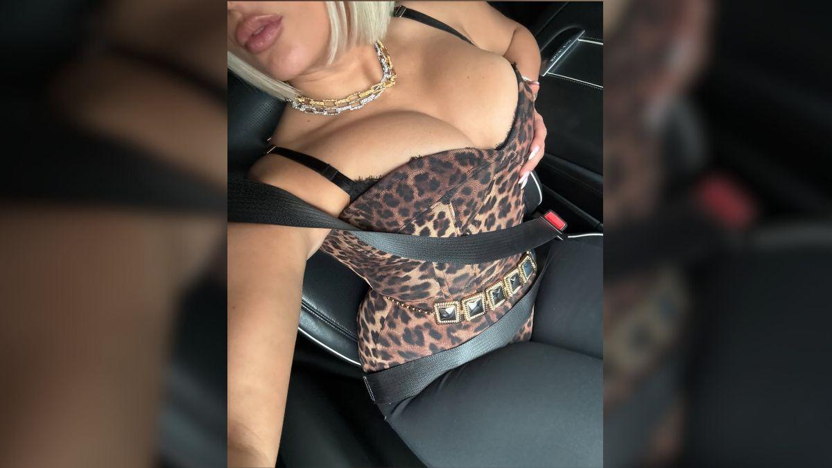 image of Rexha completed the outfit with layered gold chains.