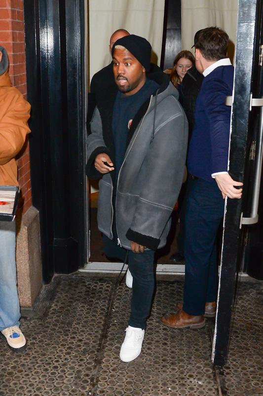 Kanye West steps out of his apartment before his fashion show starts