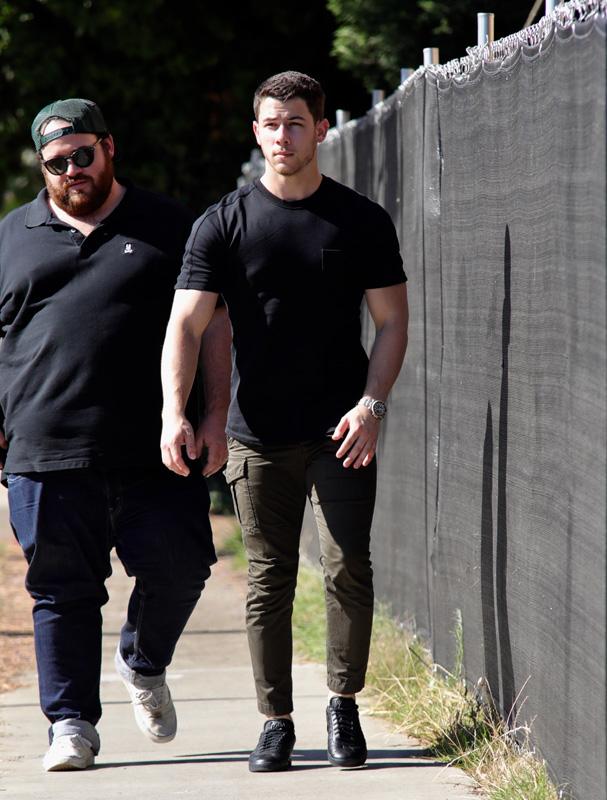 EXCLUSIVE: Nick Jonas looking ripped in a black t shirt