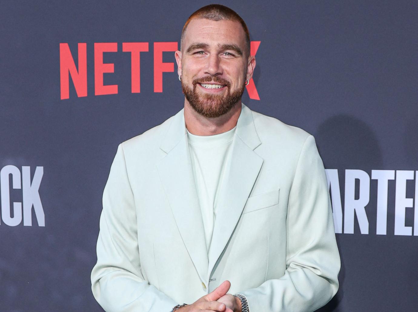 Taylor Swift Is 'Smitten' With Travis Kelce Amid First PDA Pic