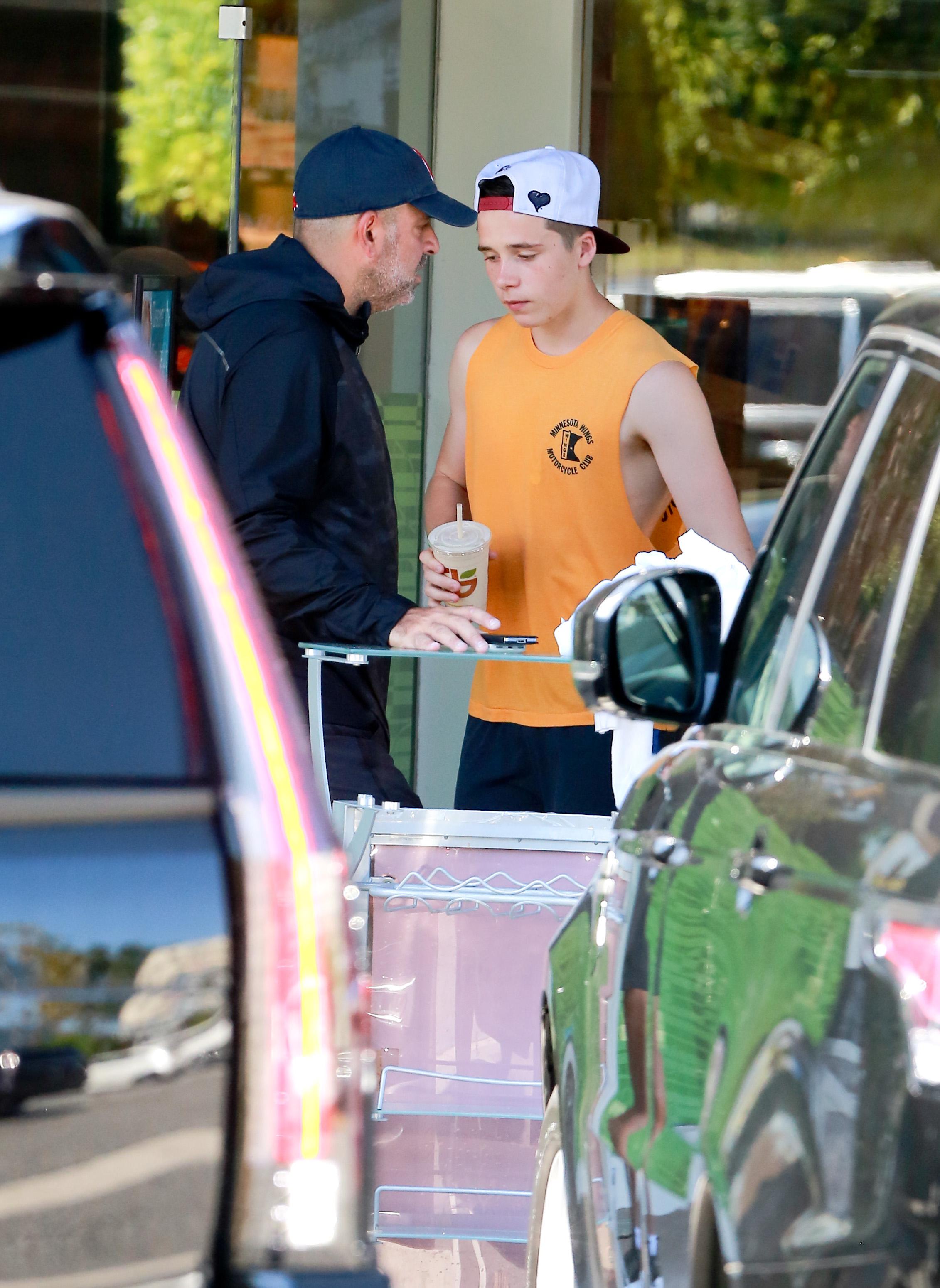 David Beckham takes Posh and Broooklyn to Soulcycle for a spinning class