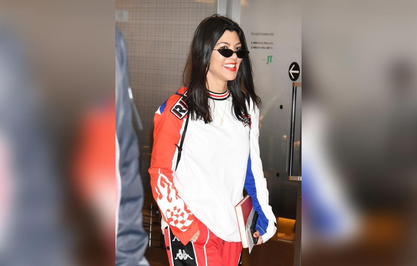 Pink haired Kim Kardashian and sisters Kourtney and Khloe Kardashian land in Tokyo