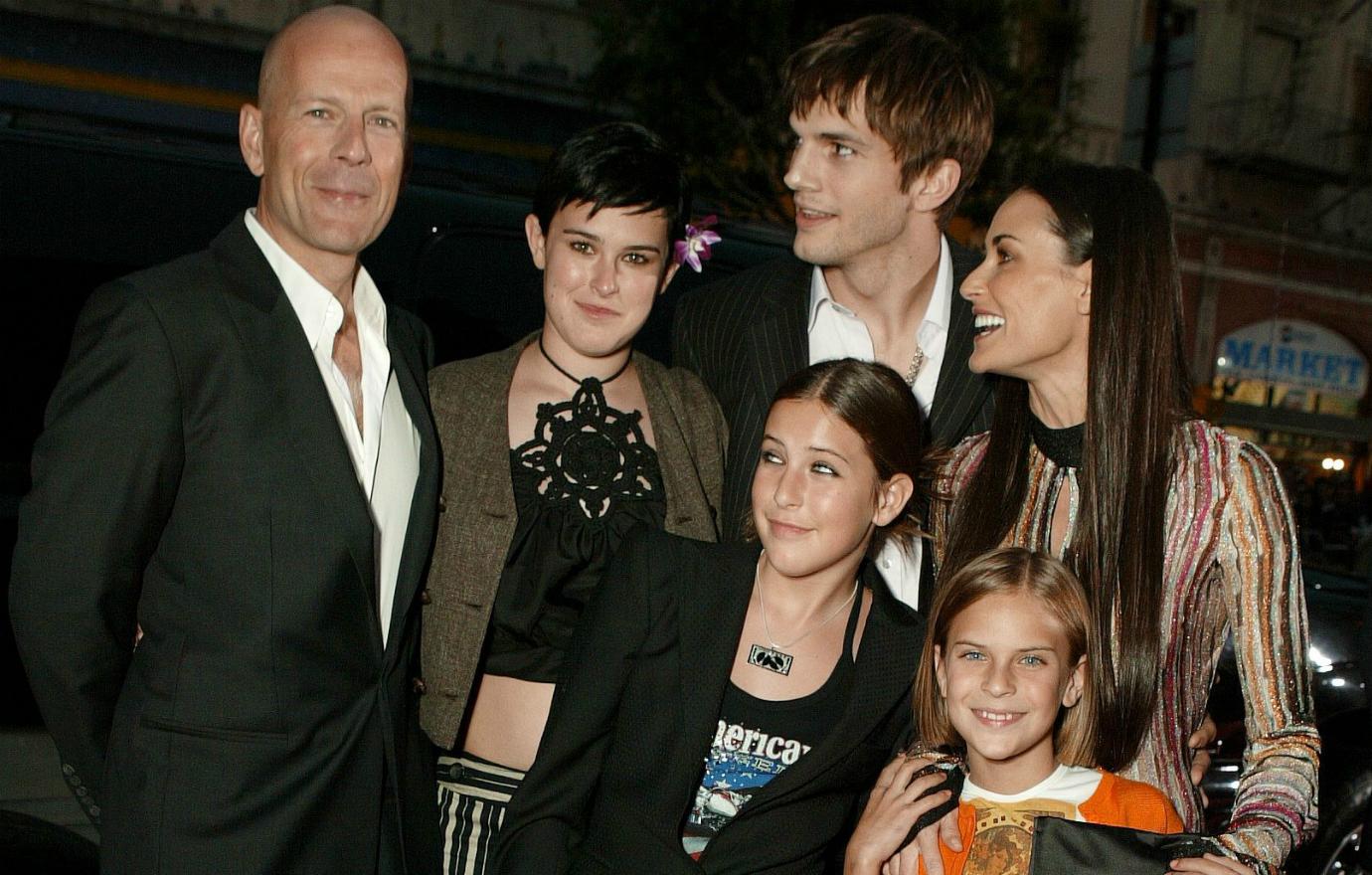 Demi Moore stands with her children, their father Bruce Willis, and ex Ashton Kutcher