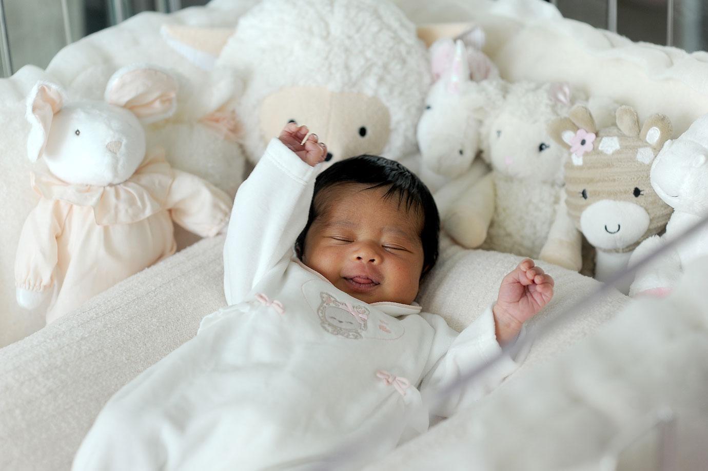 Rapper Ray J and wife Princess Love pose with their one week old baby girl Melody