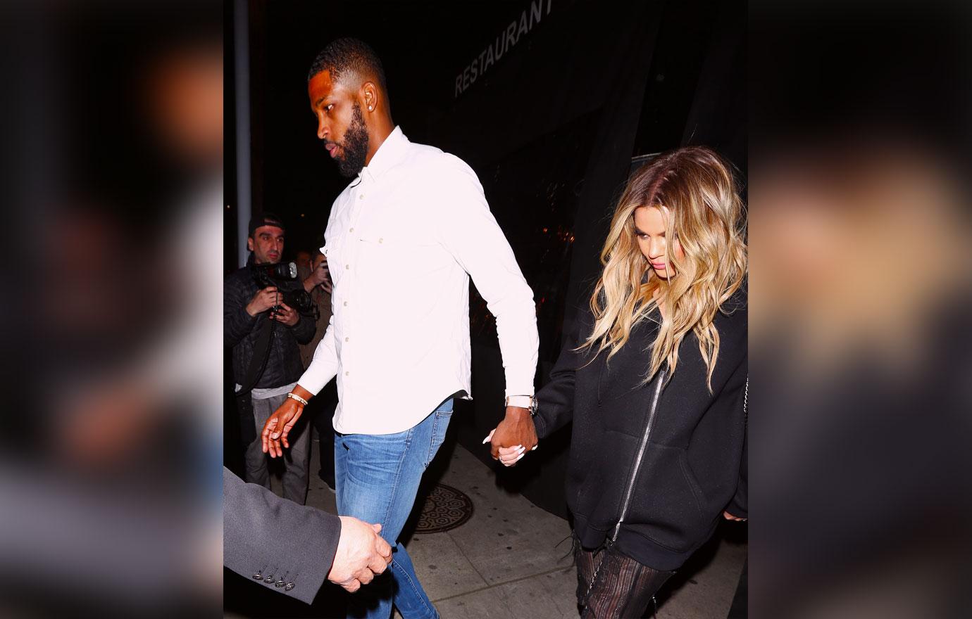 Khloe Kardashian and Tristan Thompson kiss during a dinner date in Beverly Hills