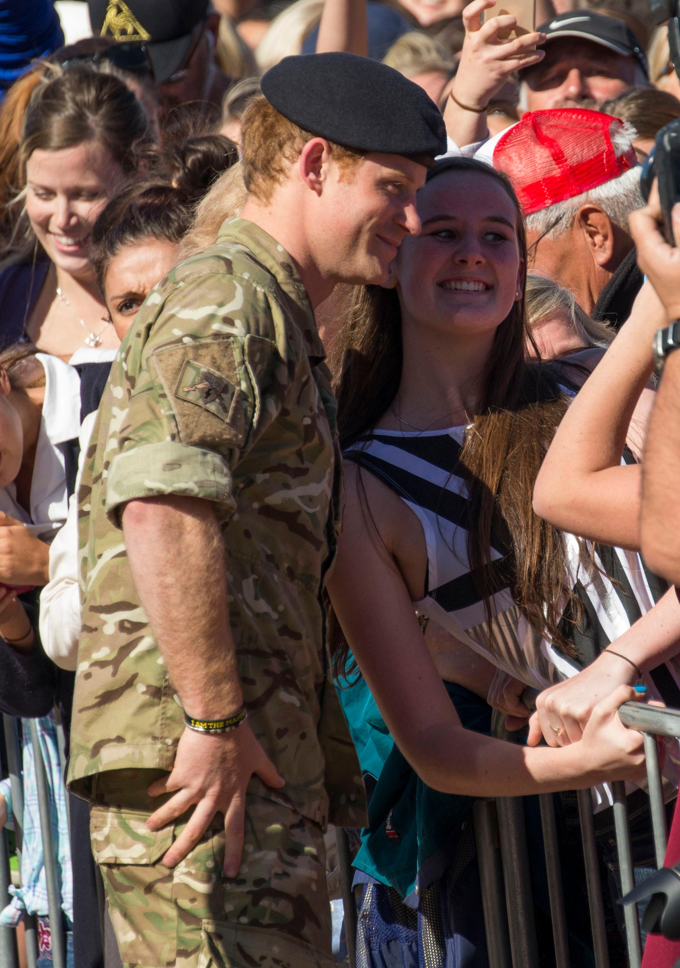 Prince Harry visits with his fans outside the Sydney Opera House **USA ONLY**