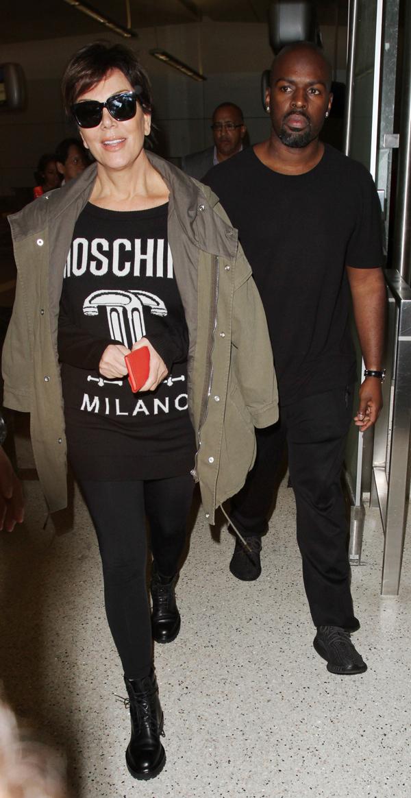 Kris Jenner and her boyfriend Corey Gamble are spotted as they arrive at LAX Airport in Los Angeles, Ca