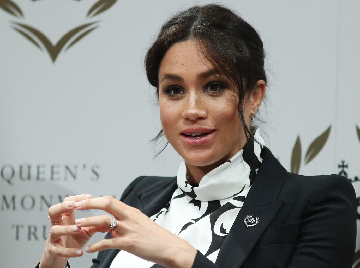 is meghan markle signing deal dior after spotify canceled podcast