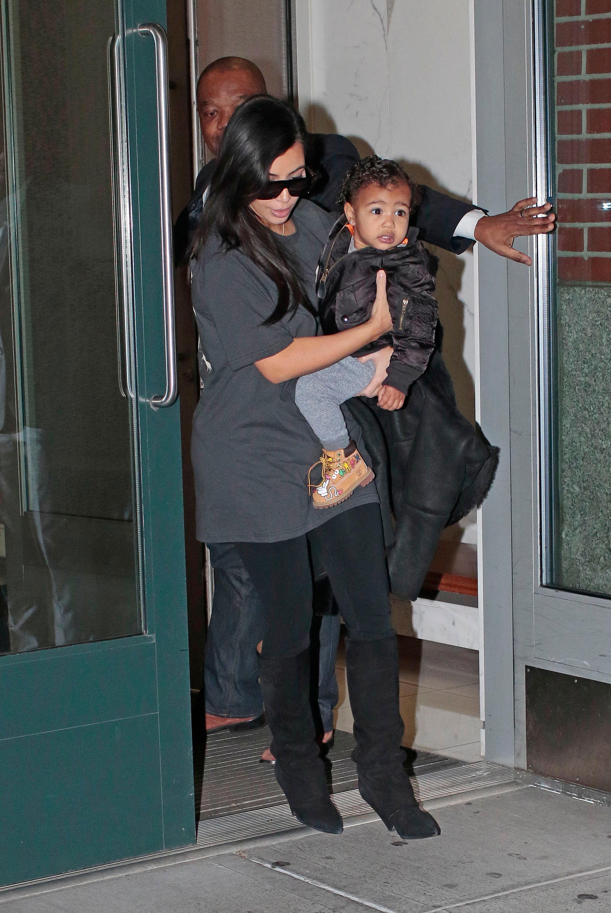 Kim Kardashian walks baby North West outside their apartment in New York City