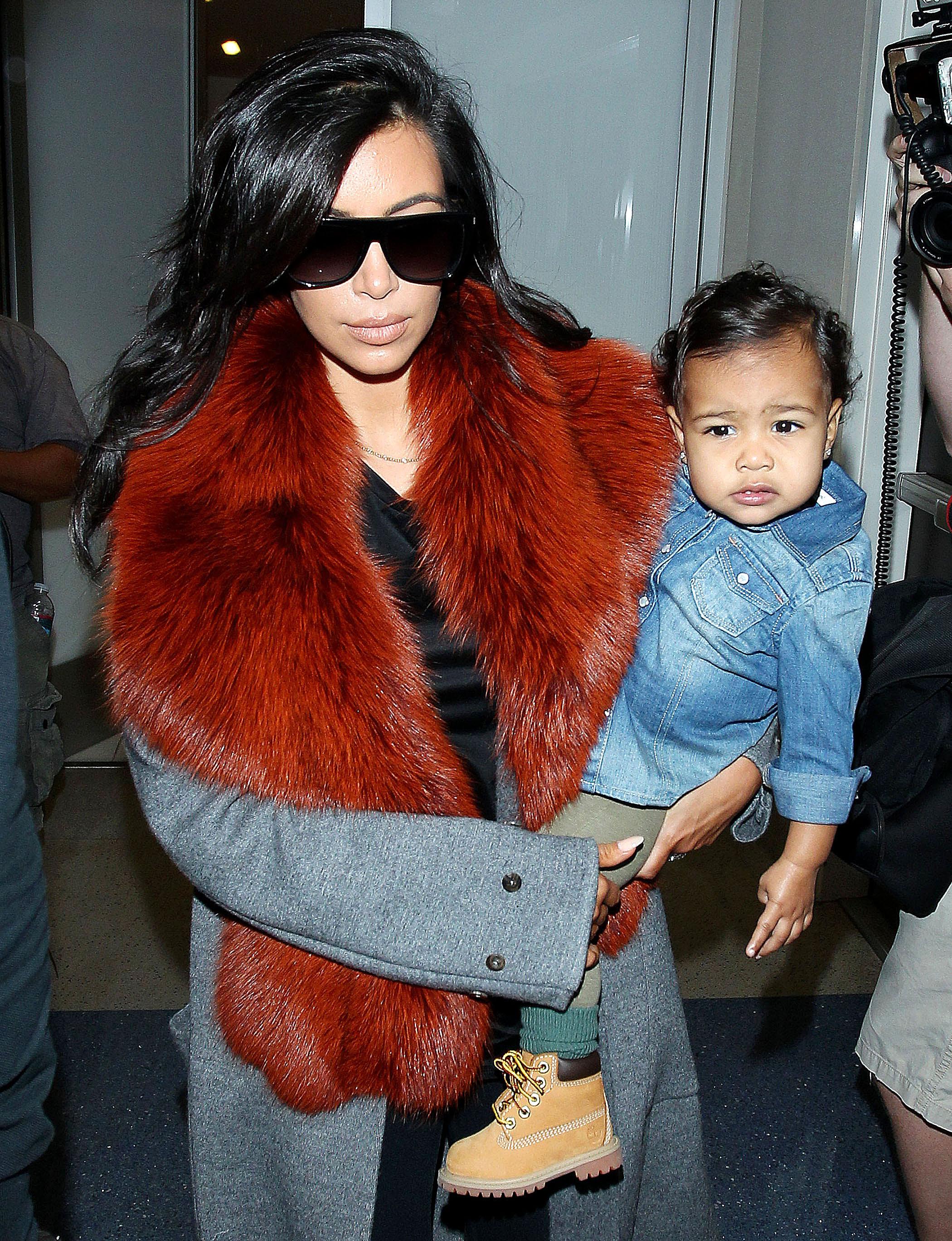 Kim Kardashian and  baby North West at the Los Angeles International Airport  ***NO DAILY MAIL SALES***