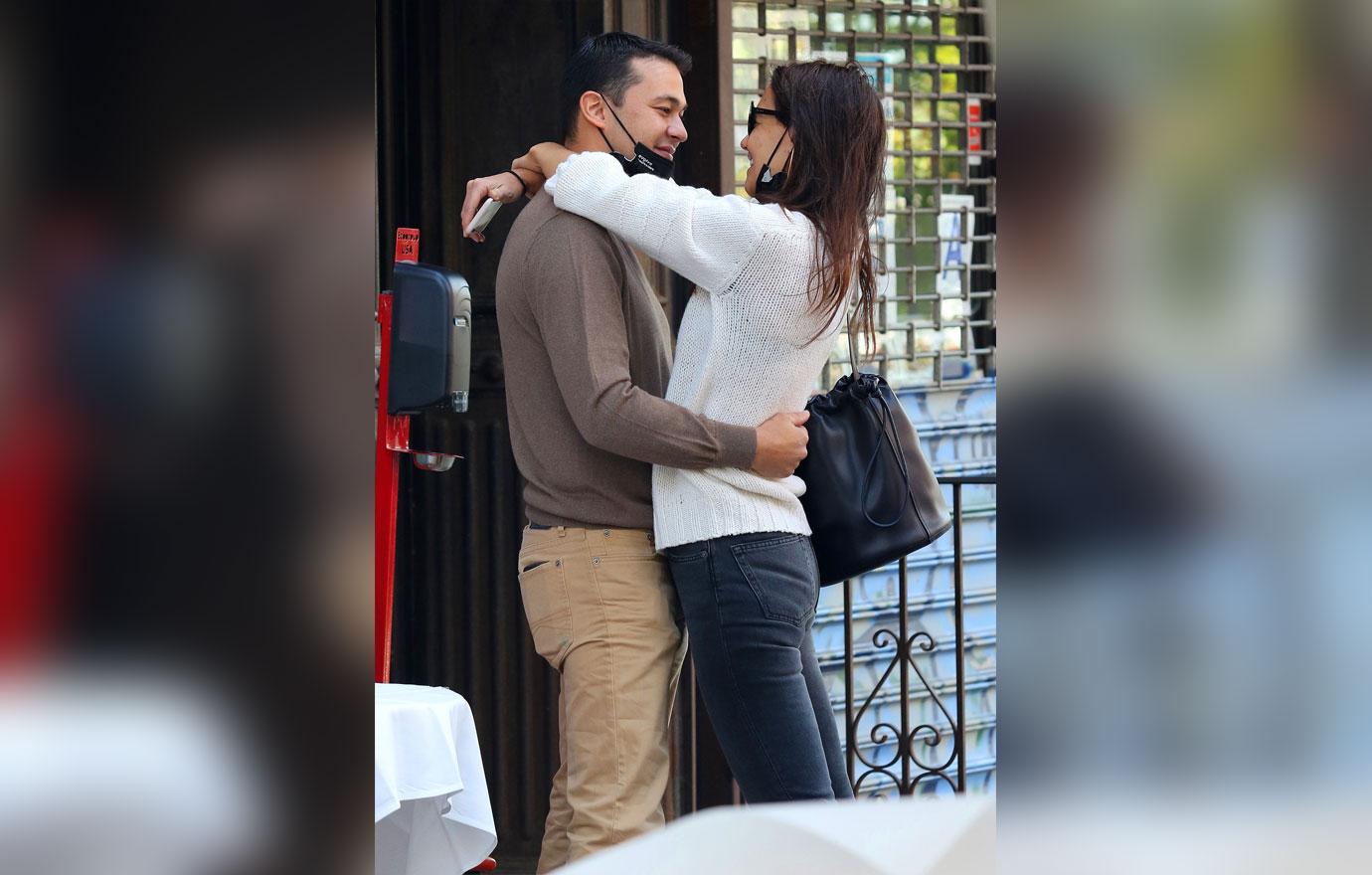 Katie Holmes and boyfriend Emilio Vitolo Jr. are all smiles as they continue another steamy make-out session outside his restaurant in NYC