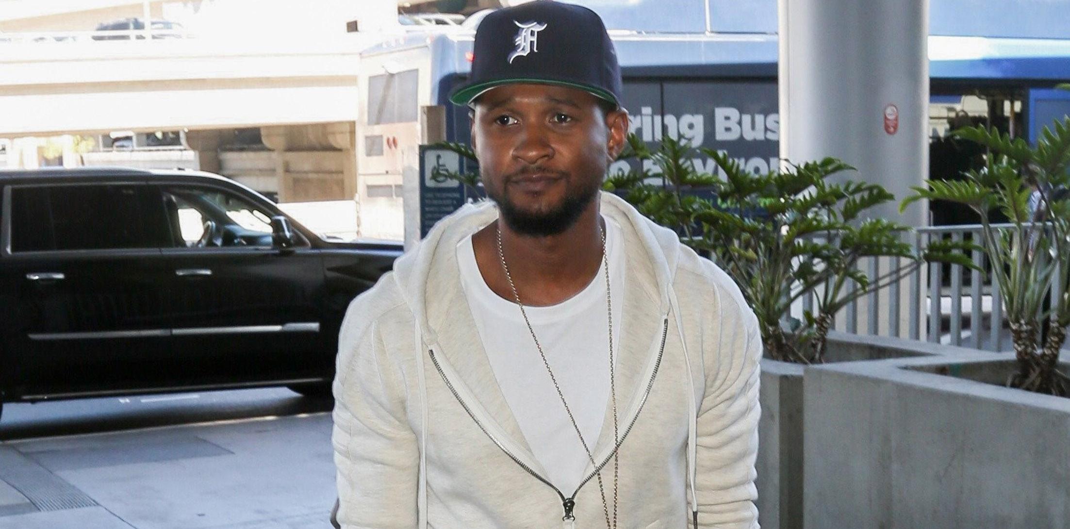 Usher takes a flight out of Los Angeles with his little guy