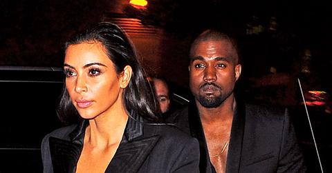 Kim Kardashian and Kanye West arrive back at their NYC in matching black blazers.