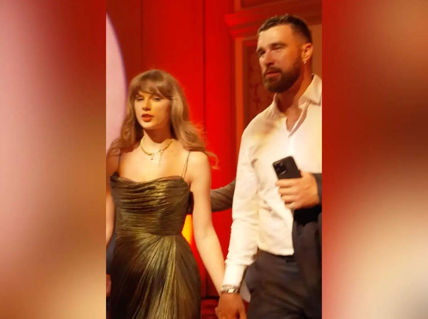 travis kelce repeatedly kisses taylor swifts shoulder watch