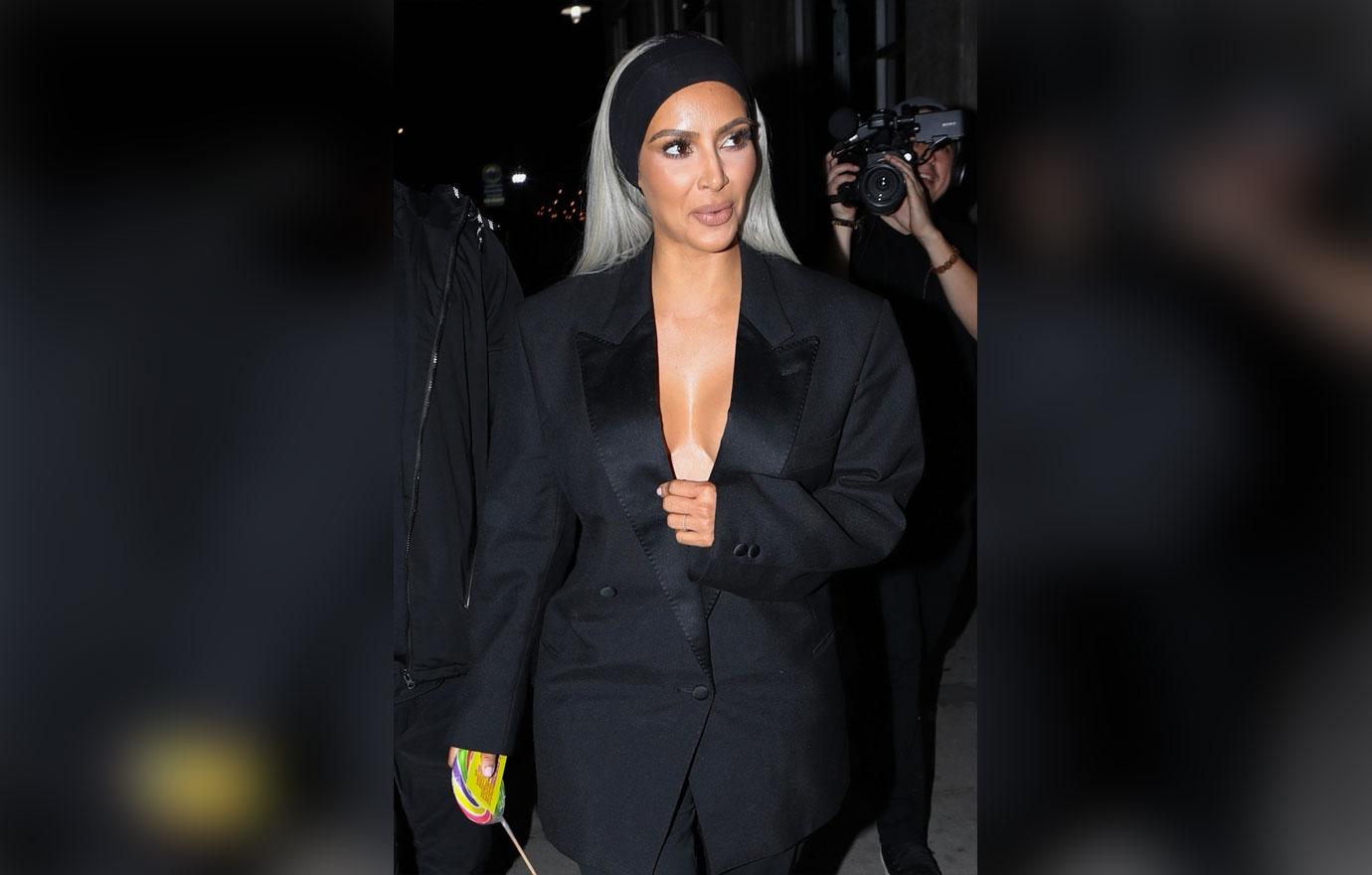 Kim Kardashian exits the Create &amp; Cultivate Conference in a plunging suit